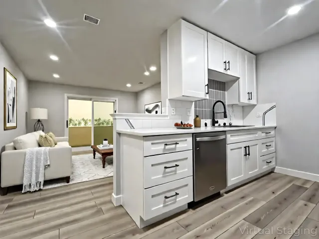 a kitchen with a sink stove and cabinets