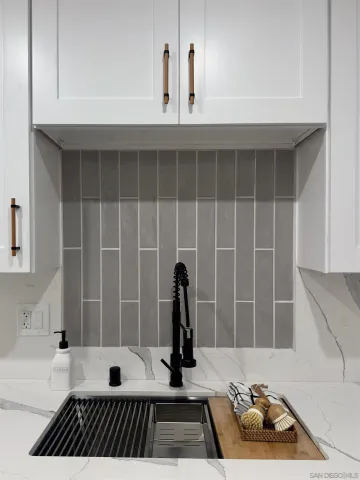 a view of a entryway with wooden floor and a potted plant
