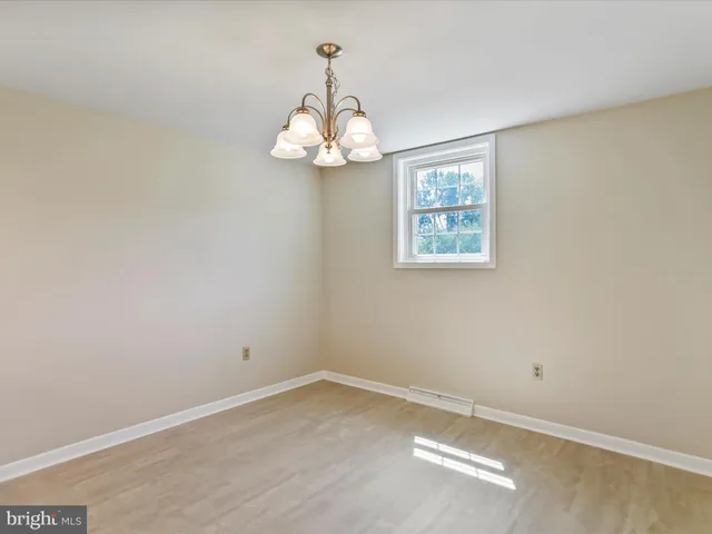 a view of a kitchen with a sink stainless steel appliances and cabinets