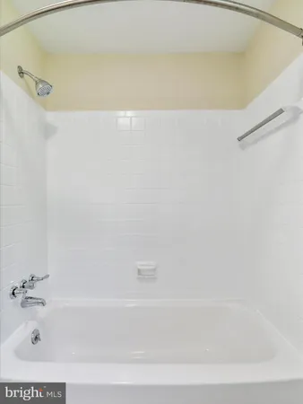 a bathroom with a toilet a sink a vanity and mirror