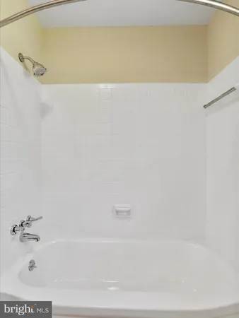 a bathroom with a sink a toilet and a window