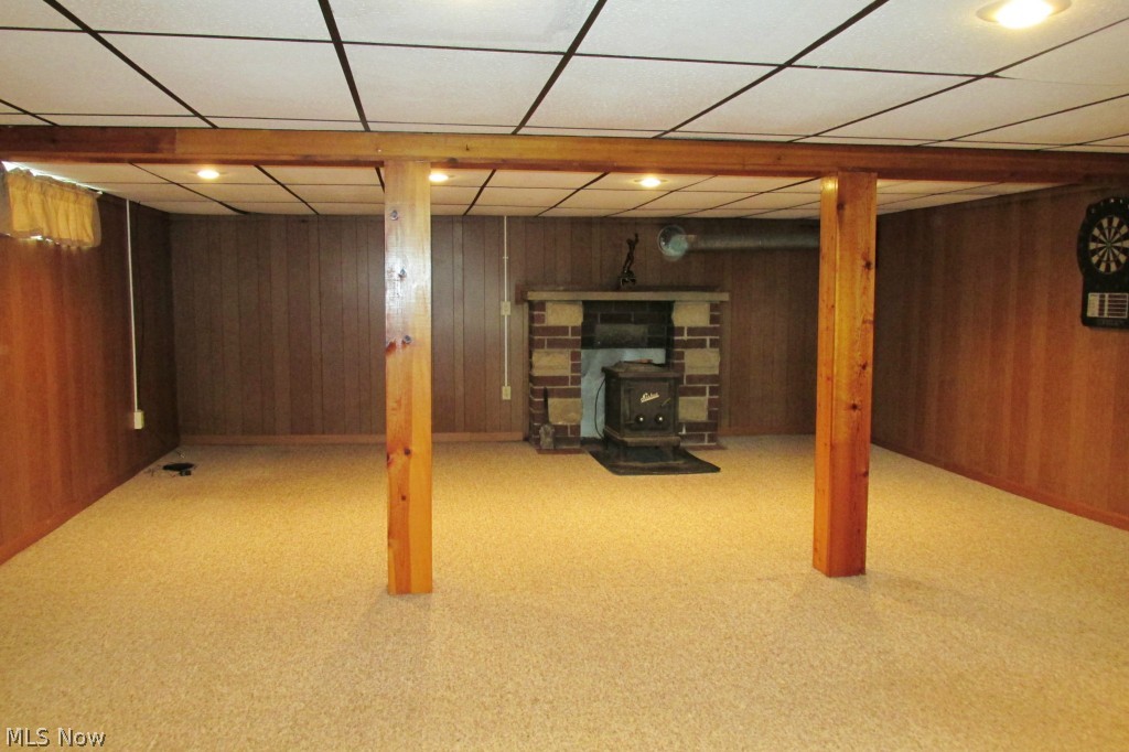 9801 Yoder Road Sterling, OH 44276 - Photo 17 of 25 Lower level family/recreation room (20 x 26) with free standing wood stove
