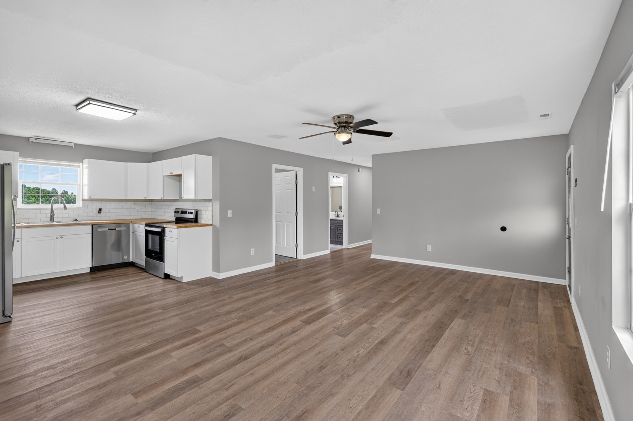 120 Driver Road Lafayette, TN 37083 - Photo 9 of 39 a view of a kitchen with a sink wooden floor and a window