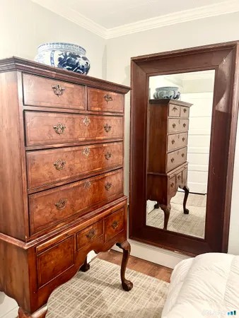 a view of a dresser with wooden floor