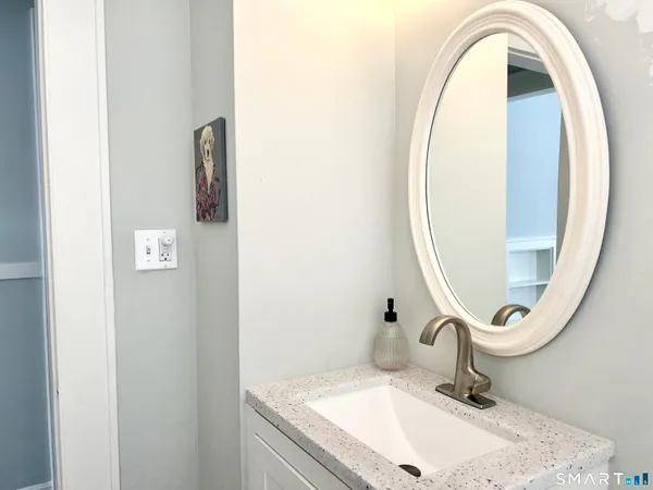 a bathroom with a sink and a mirror