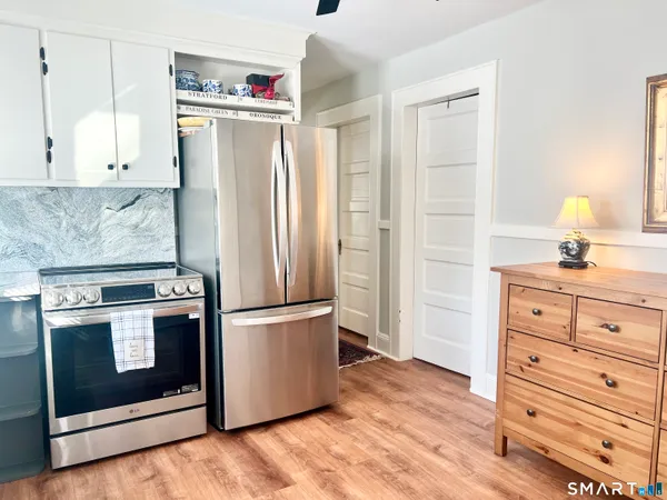 a kitchen with a stove and a refrigerator