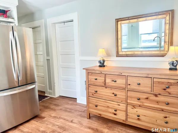 a view of closet with wooden floor