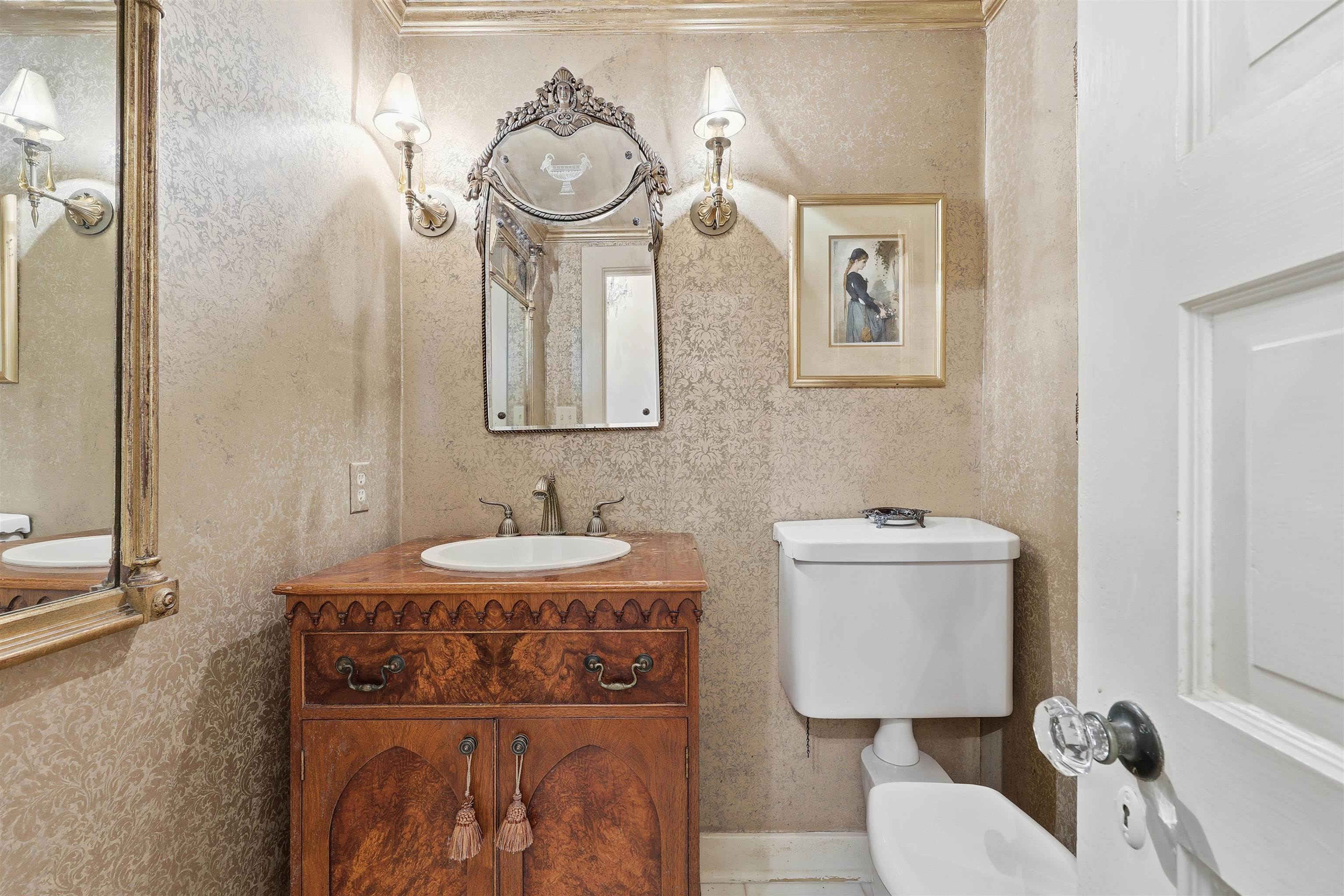 124 Marine Street St. Augustine, FL 32084 - Photo 14 of 41 a bathroom with a sink vanity mirror and toilet