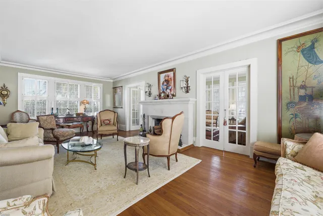 a living room with furniture a fireplace and a table