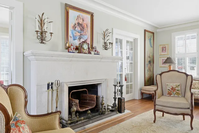 a living room with furniture a dining table and wooden floor