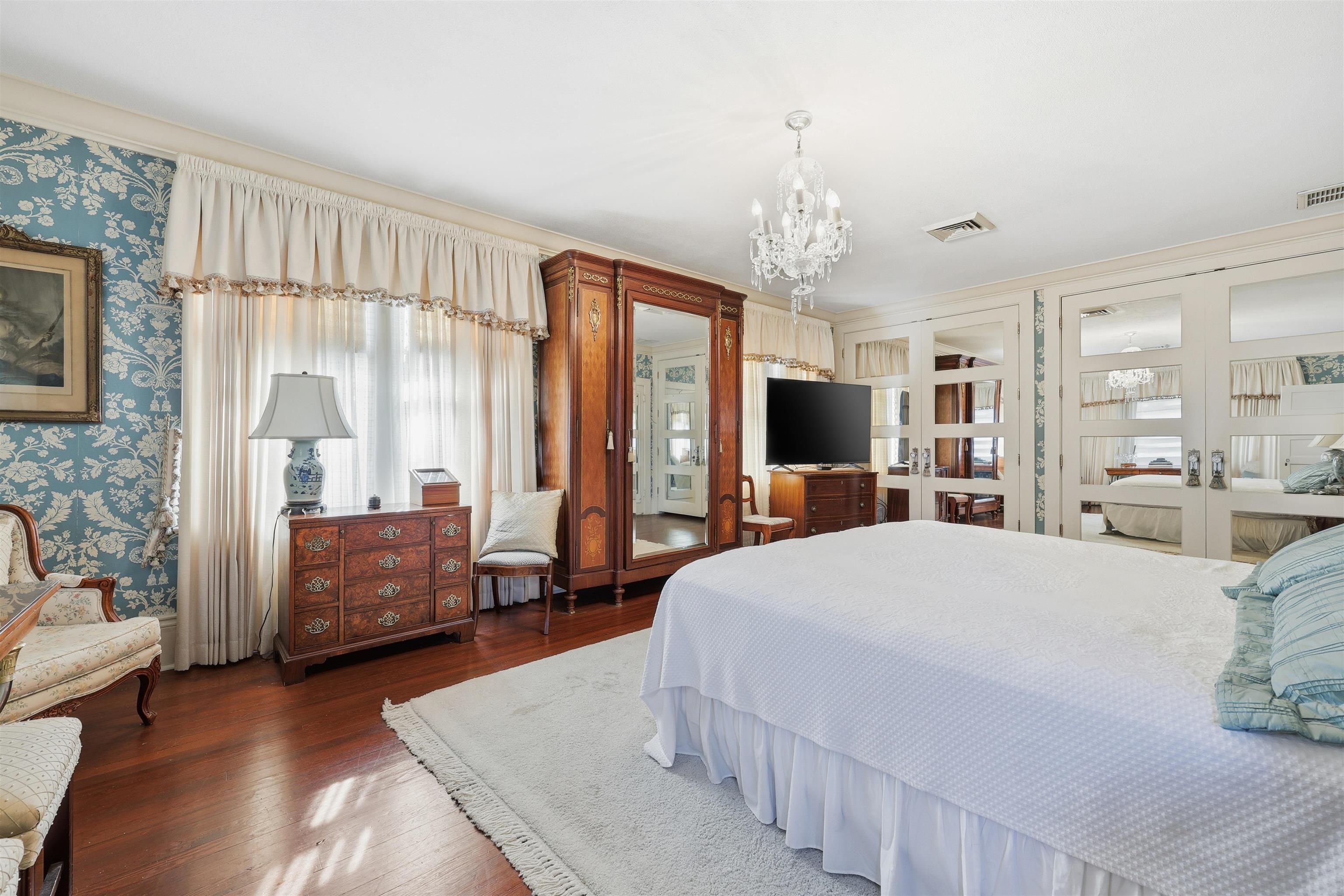 124 Marine Street St. Augustine, FL 32084 - Photo 21 of 41 a spacious bedroom with a bed and a couch