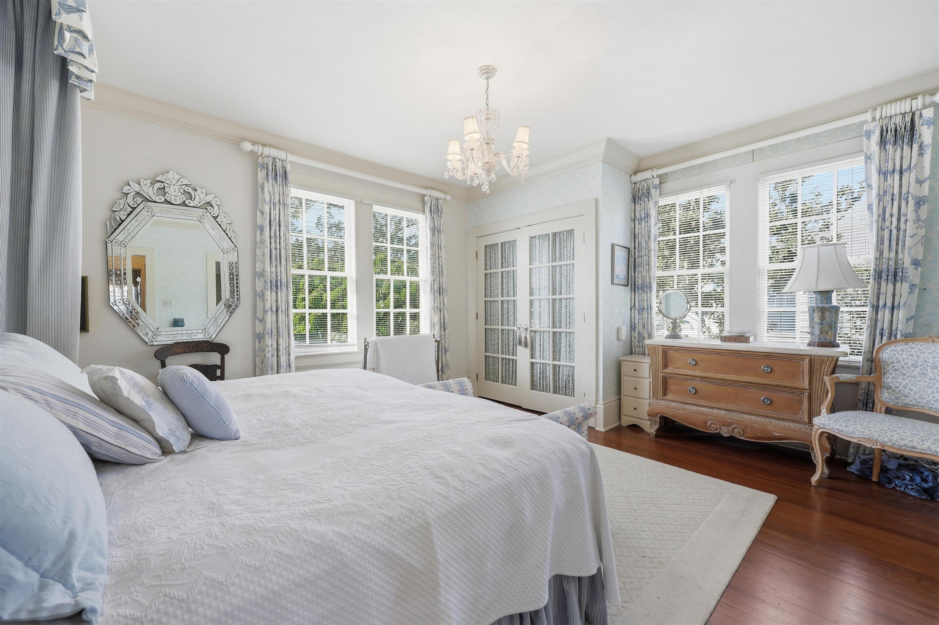 124 Marine Street St. Augustine, FL 32084 - Photo 23 of 41 a bedroom with a bed and a couch next to a window