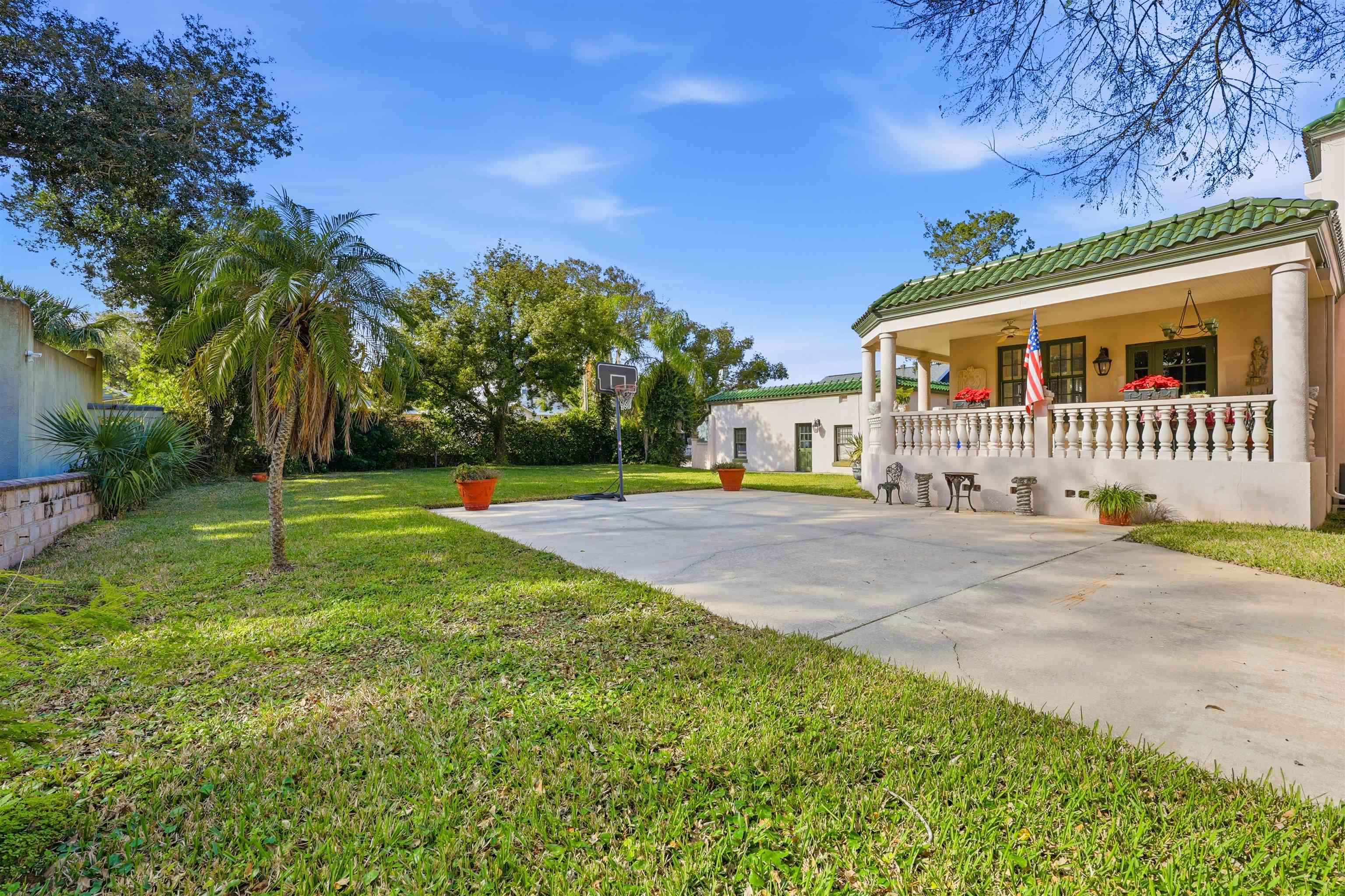 124 Marine Street St. Augustine, FL 32084 - Photo 30 of 41 a front view of a house with a yard and trees