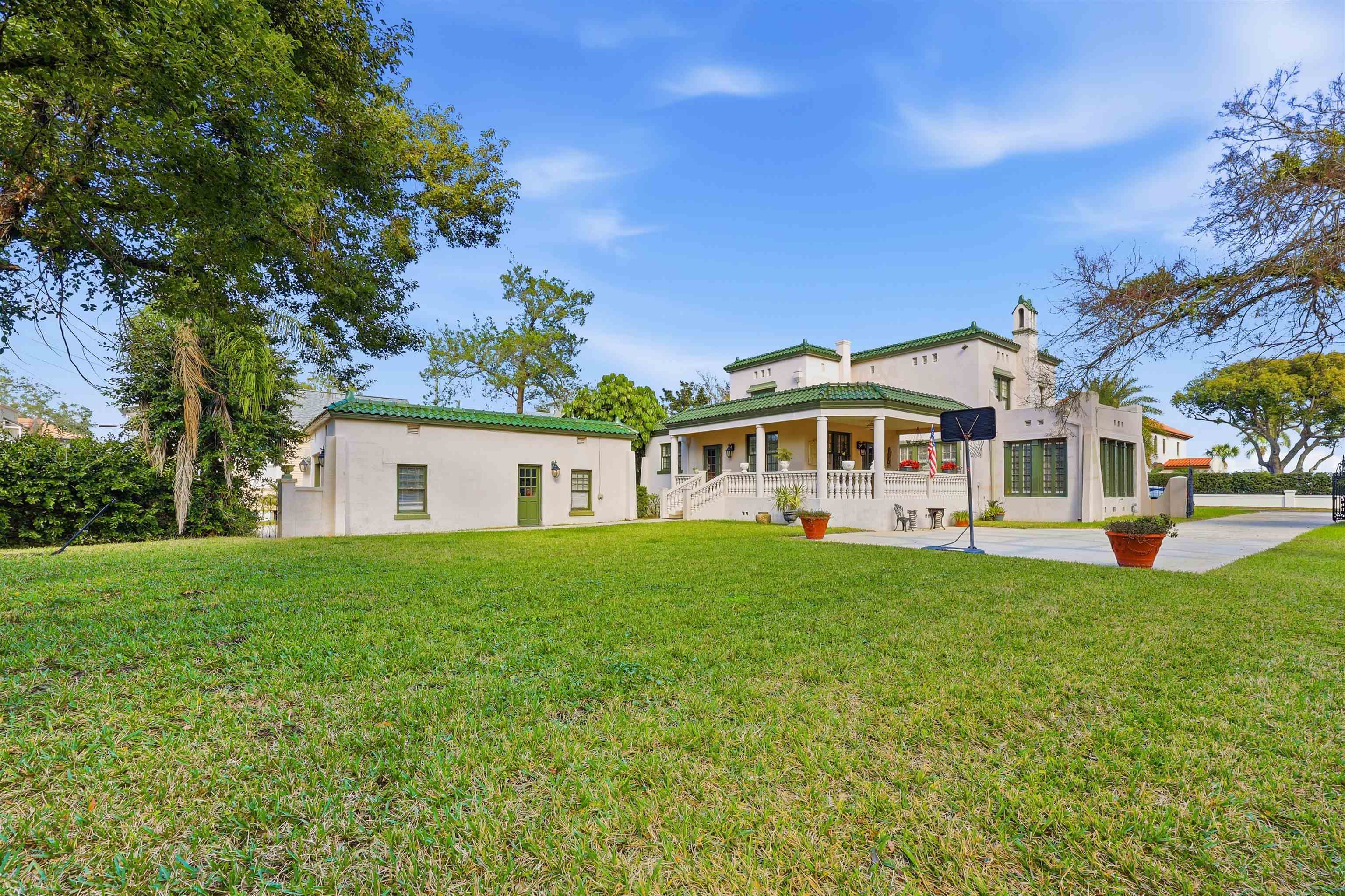 124 Marine Street St. Augustine, FL 32084 - Photo 31 of 41 a front view of a house with a garden