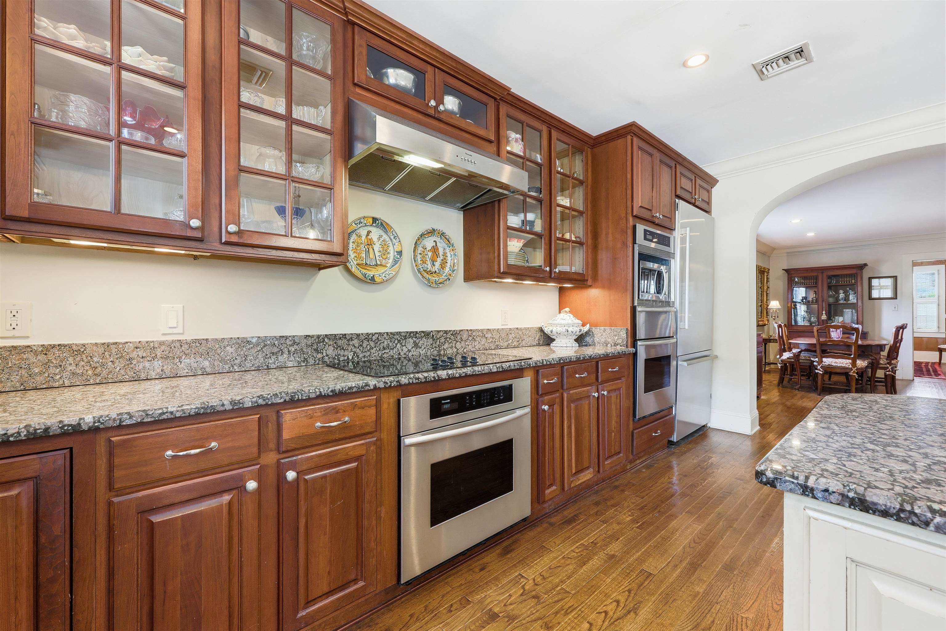 124 Marine Street St. Augustine, FL 32084 - Photo 3 of 41 a kitchen with stainless steel appliances granite countertop a stove and cabinets