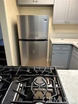 a close view of a stove top oven and sitting space