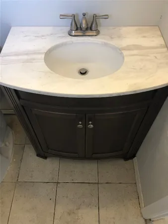 a bathroom with a sink and vanity