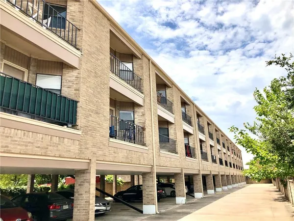 a front view of a building with many windows