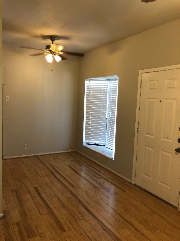 3316 Guadalupe Street, Unit 201 Austin, TX 78705 - Photo 4 of 19 a view of an empty room with wooden floor and a window