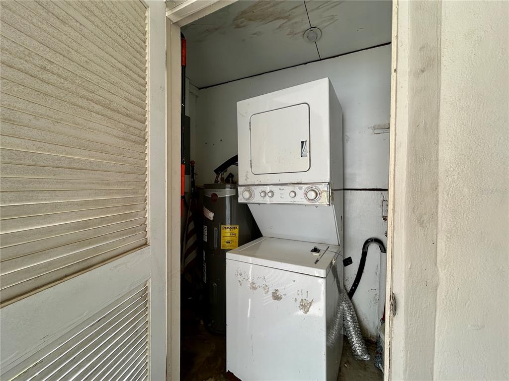 144 175th Avenue East, Unit 1 Redington Shores, FL 33708 - Photo 15 of 15 a utility room with dryer and washer