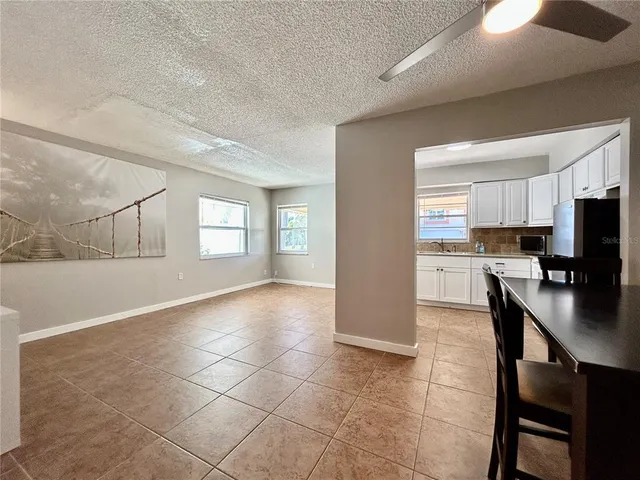 a view of a kitchen center island and living room