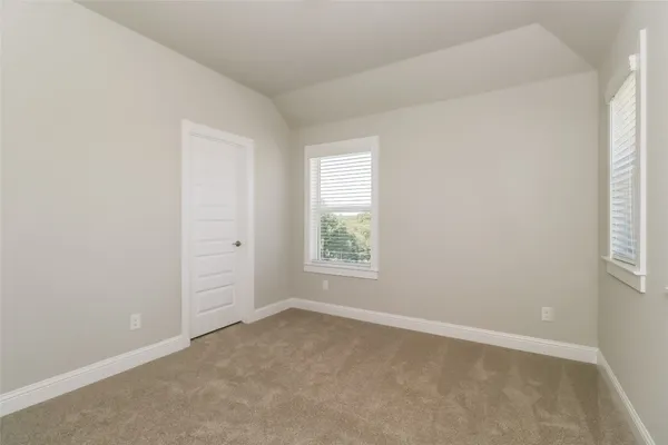 an empty room with closet area