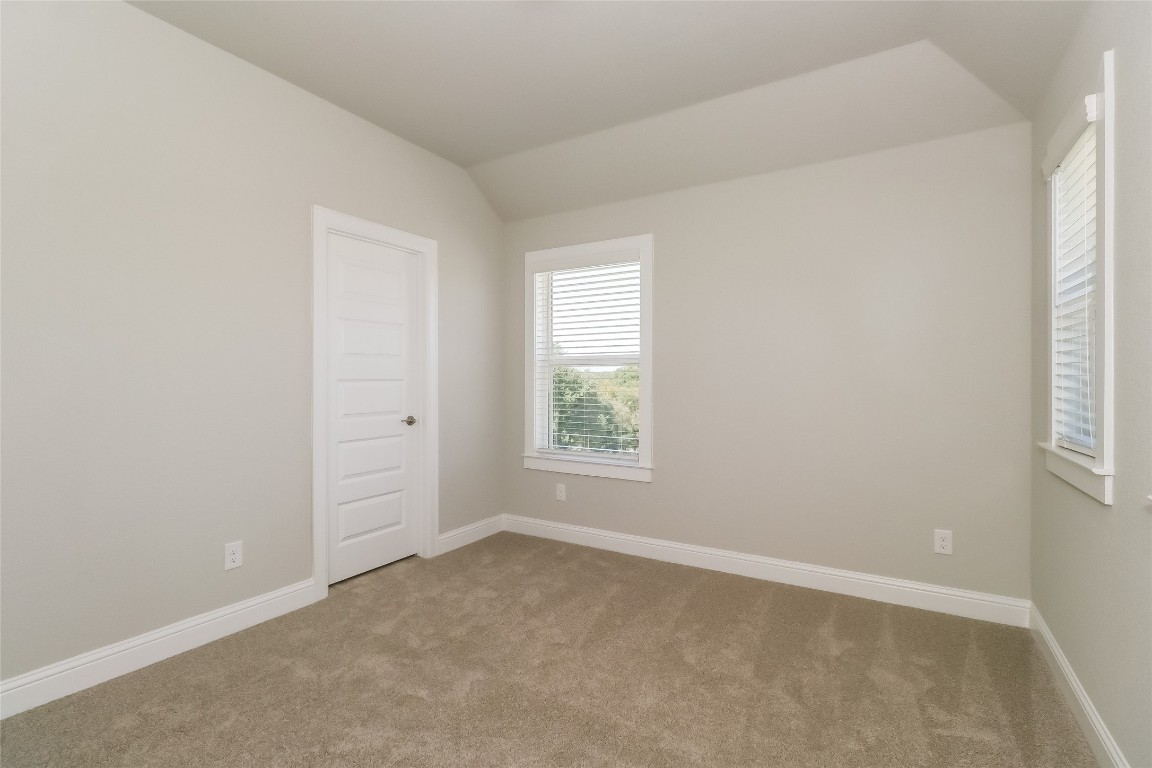 2605 Sam Bass Road, Unit 42 Round Rock, TX 78681 - Photo 18 of 27 an empty room with windows