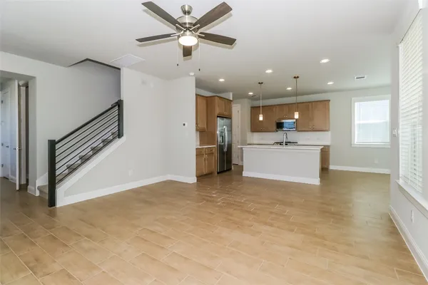 a view of a kitchen with a sink cabinets and a window