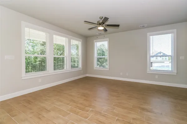 a view of an empty room with a window