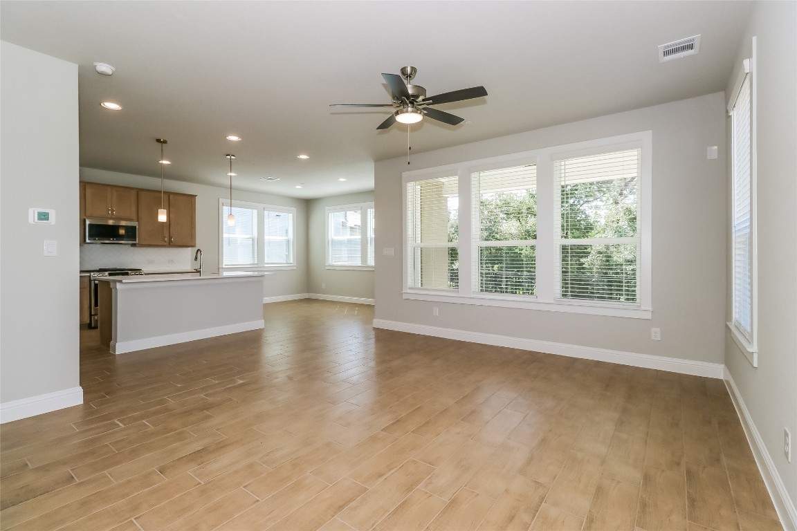 2605 Sam Bass Road, Unit 42 Round Rock, TX 78681 - Photo 6 of 27 a view of an empty room with window and cabinet