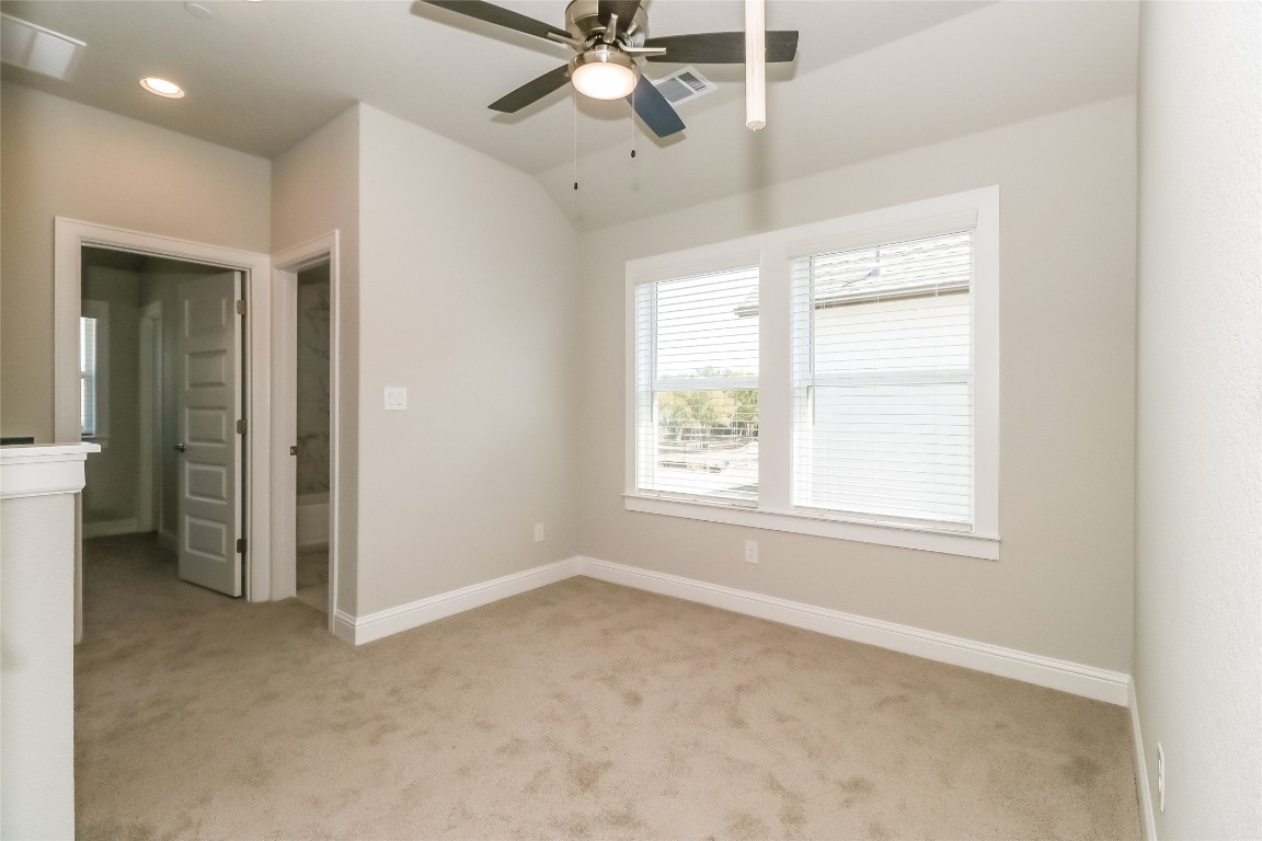 2605 Sam Bass Road, Unit 42 Round Rock, TX 78681 - Photo 8 of 27 a view of an empty room with a window