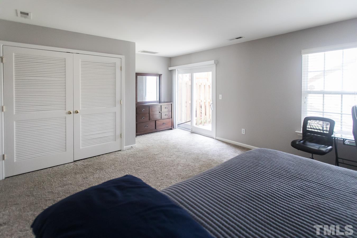 3137 Winding Waters Way Raleigh, NC 27614 - Photo 36 of 54 a bedroom with a bed and a window
