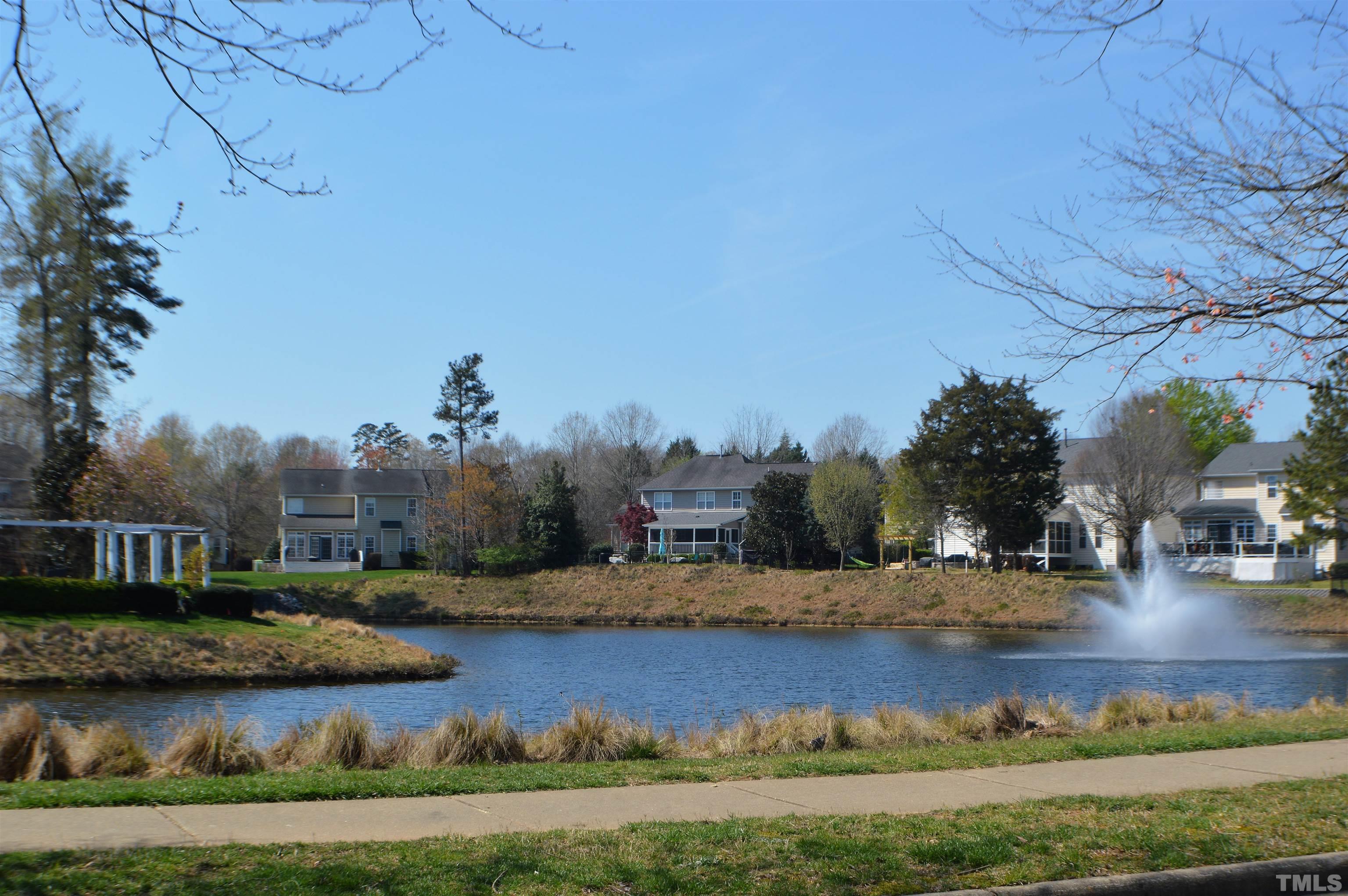 3137 Winding Waters Way Raleigh, NC 27614 - Photo 53 of 54 a view of a lake with houses