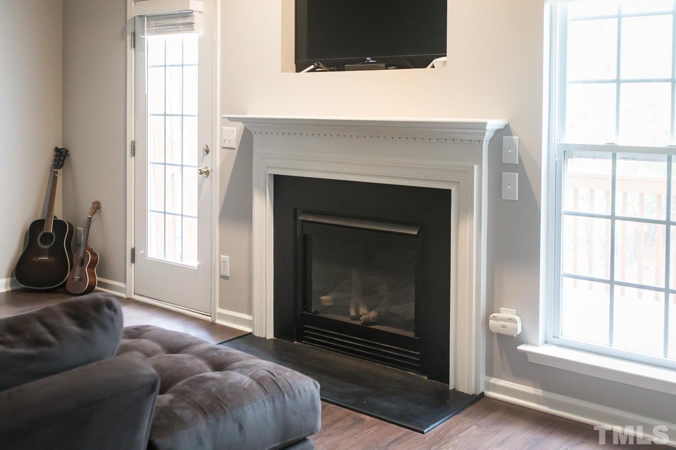 3137 Winding Waters Way Raleigh, NC 27614 - Photo 8 of 54 a living room with furniture and a fireplace