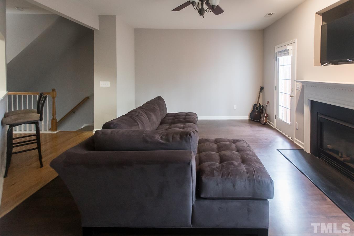 3137 Winding Waters Way Raleigh, NC 27614 - Photo 9 of 54 a living room with furniture and a fireplace