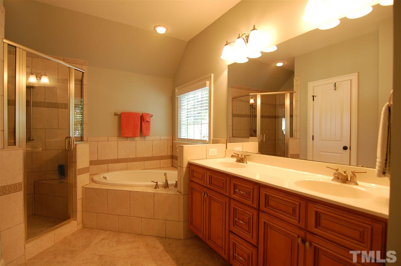 616 New Road Raleigh, NC 27608 - Photo 13 of 25 a bathroom with a granite countertop sink mirror and bathtub