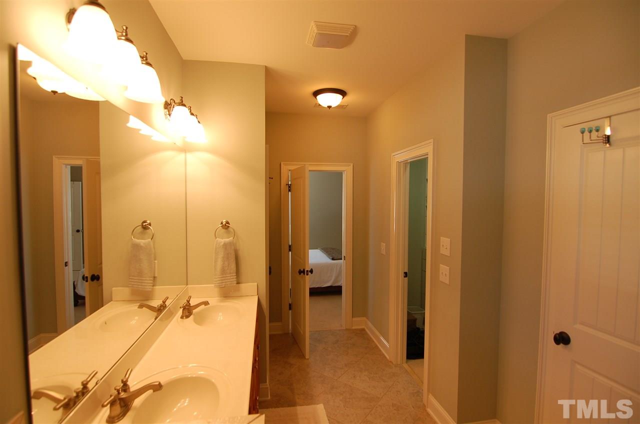 616 New Road Raleigh, NC 27608 - Photo 14 of 25 a bathroom with a tub and shower
