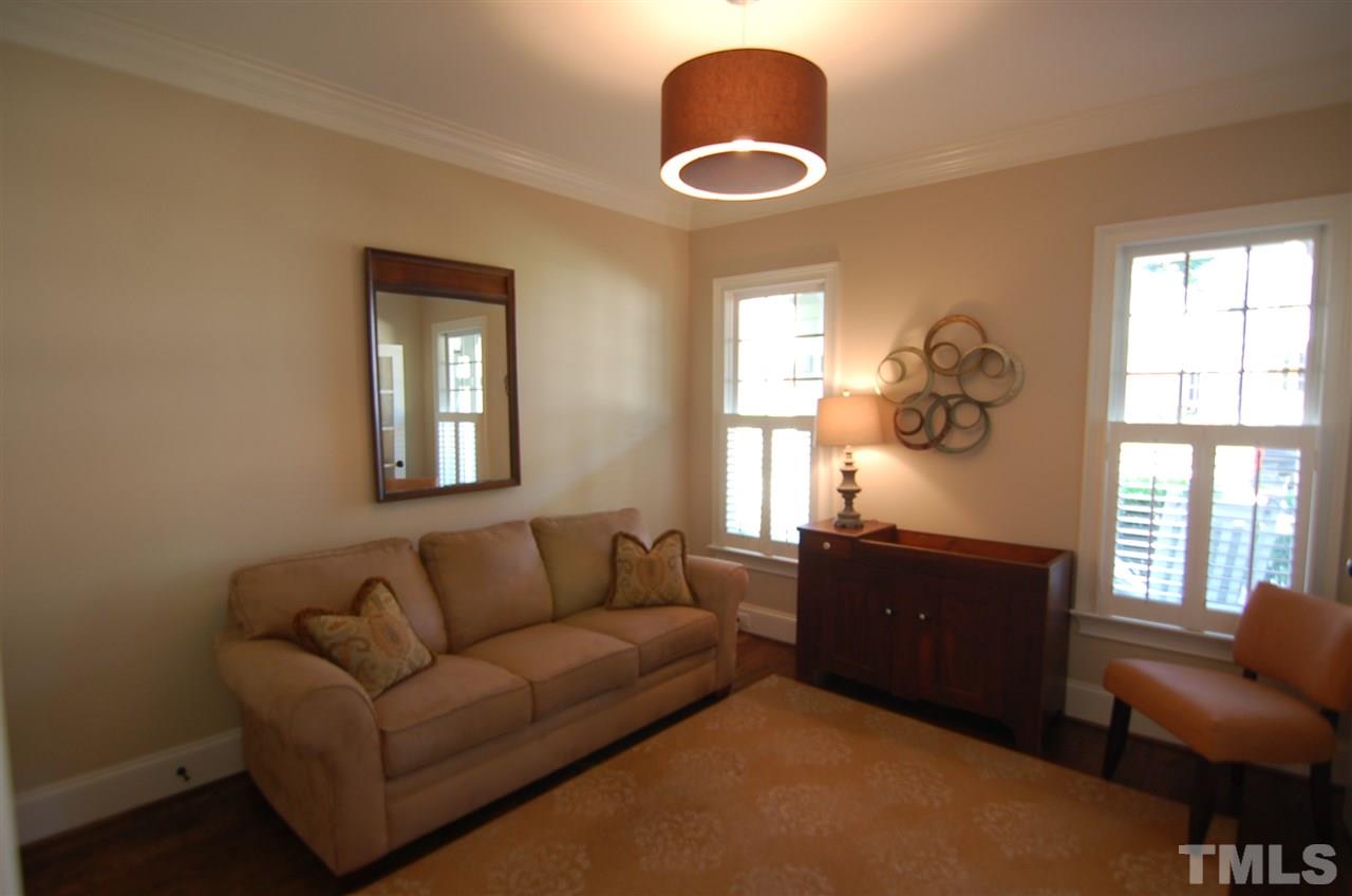 616 New Road Raleigh, NC 27608 - Photo 19 of 25 a living room with furniture and a window