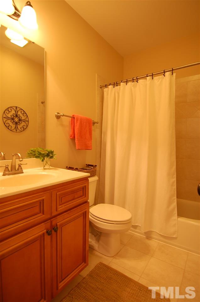 616 New Road Raleigh, NC 27608 - Photo 20 of 25 a bathroom with a sink a toilet and shower