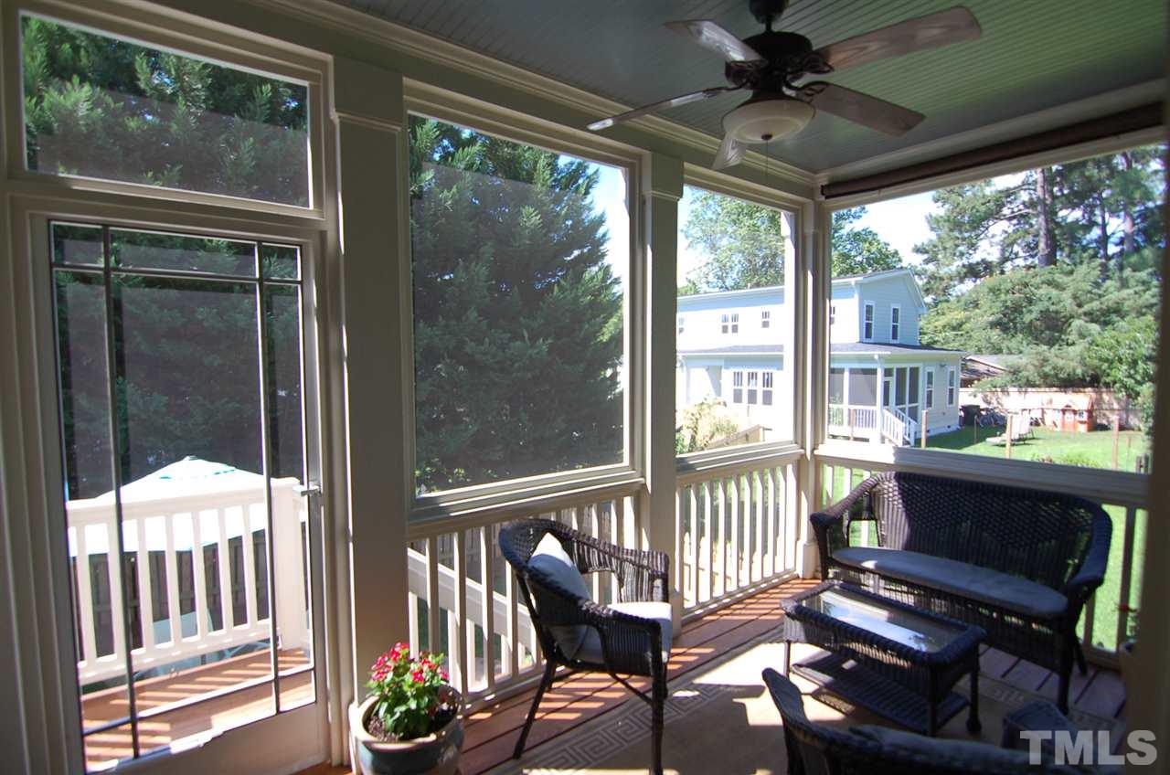 616 New Road Raleigh, NC 27608 - Photo 23 of 25 a view of a porch with furniture and a yard