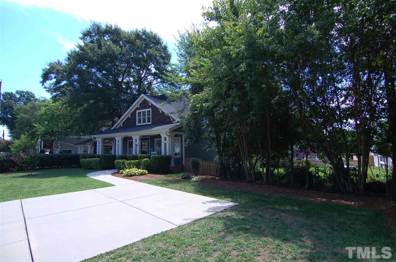 616 New Road Raleigh, NC 27608 - Photo 25 of 25 a front view of a house with yard and green space