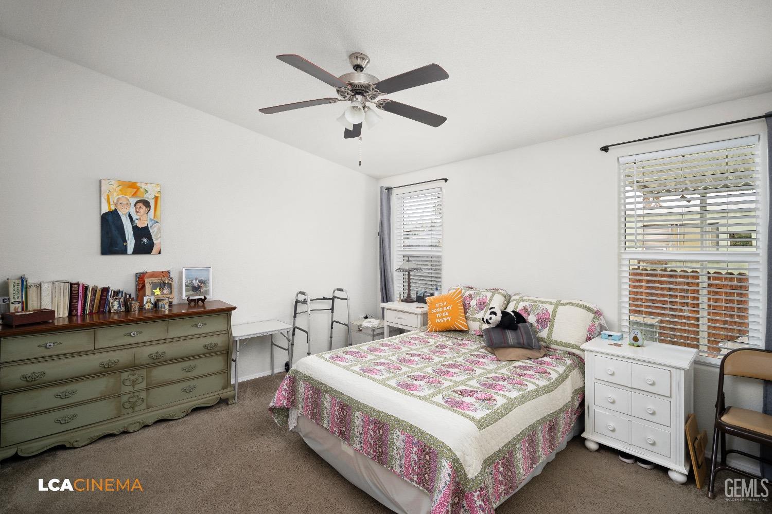 Undisclosed Address Bakersfield, CA 93304 - Photo 13 of 18 a bedroom with a bed and a dresser in it