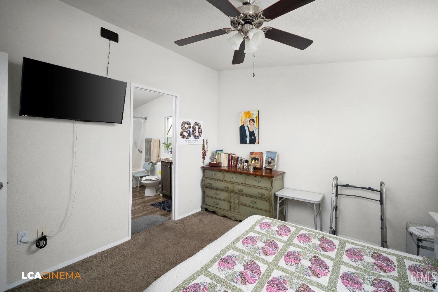 Undisclosed Address Bakersfield, CA 93304 - Photo 14 of 18 a bedroom with a bed and a flat screen tv