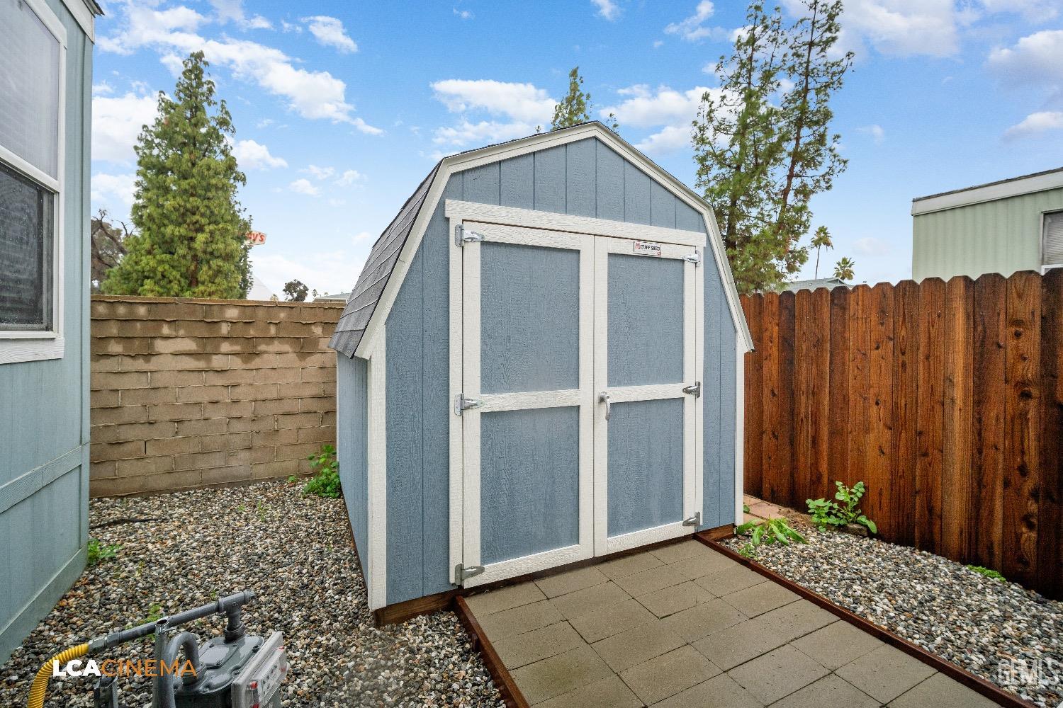 Undisclosed Address Bakersfield, CA 93304 - Photo 18 of 18 a yellow house with a outdoor space