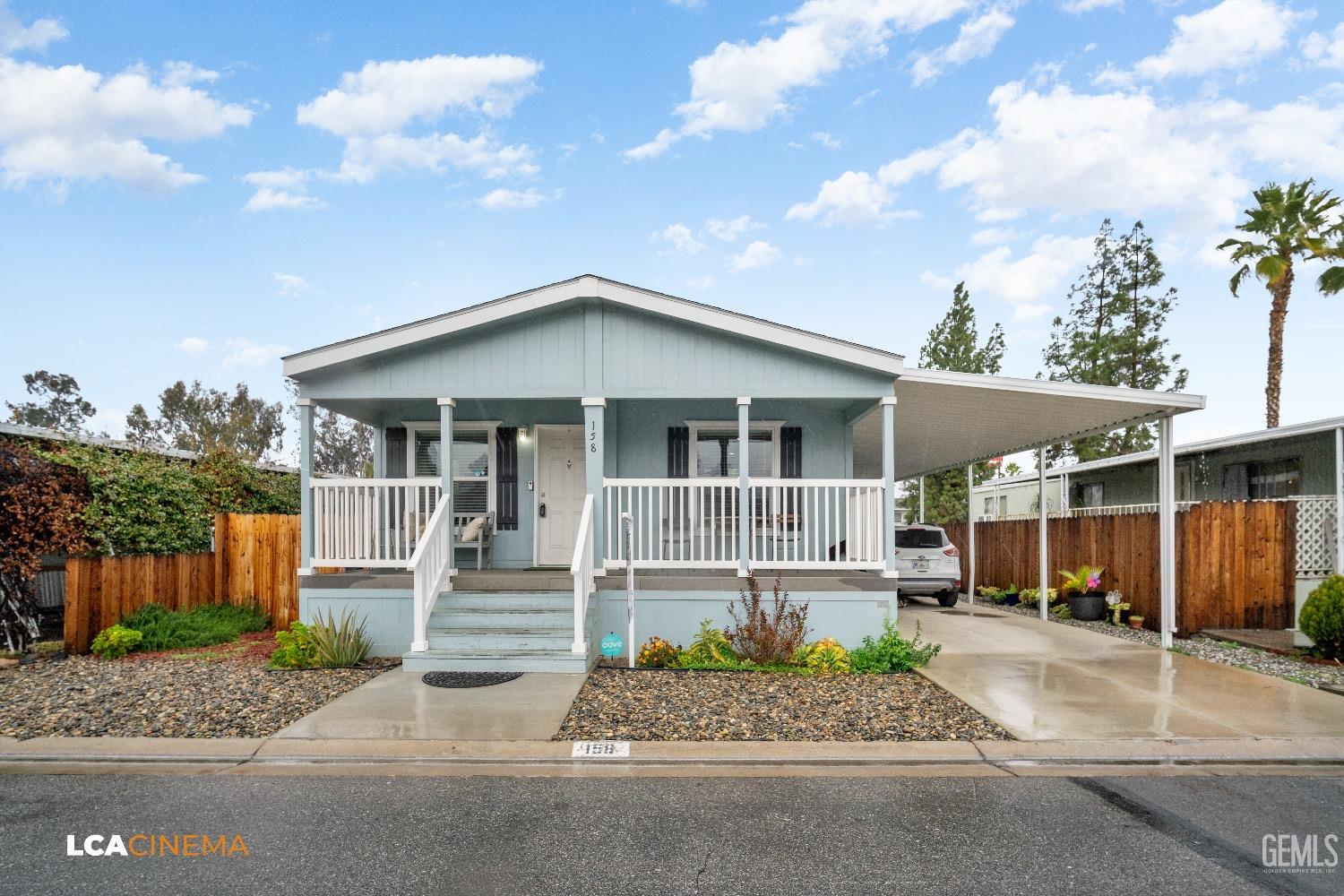Undisclosed Address Bakersfield, CA 93304 - Photo 2 of 18 a front view of a house with garden