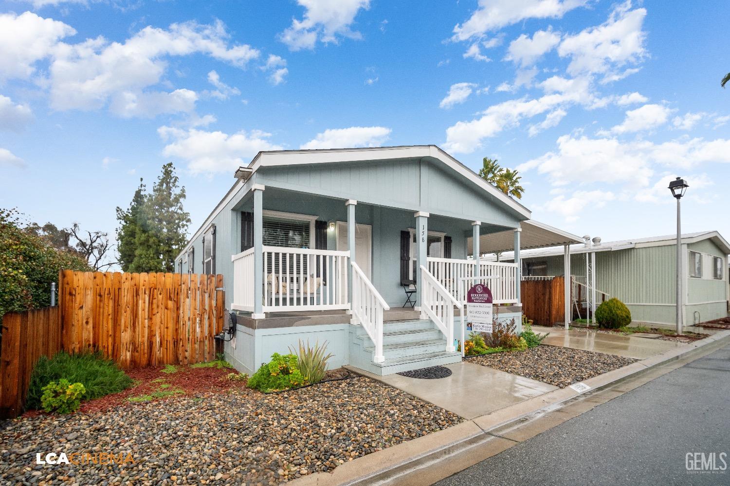 Undisclosed Address Bakersfield, CA 93304 - Photo 3 of 18 a front view of a house with garden
