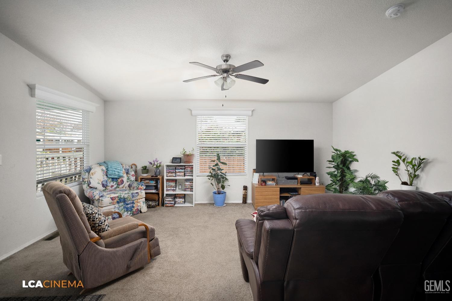 Undisclosed Address Bakersfield, CA 93304 - Photo 6 of 18 a living room with furniture and a flat screen tv