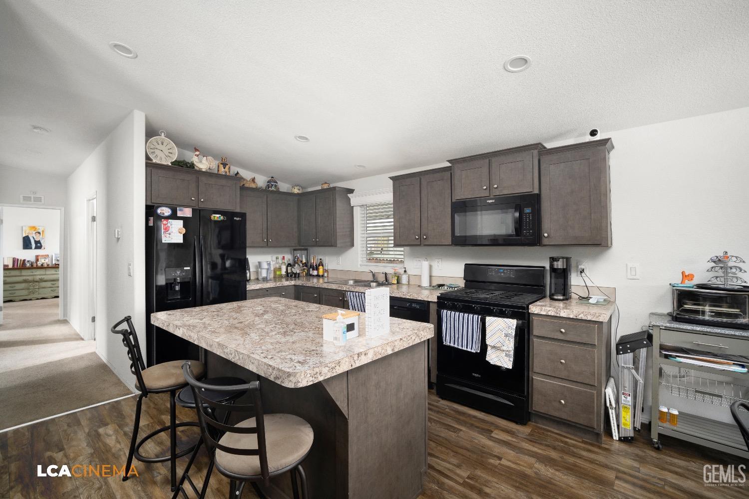 Undisclosed Address Bakersfield, CA 93304 - Photo 8 of 18 a kitchen with stainless steel appliances granite countertop a stove refrigerator and a stove