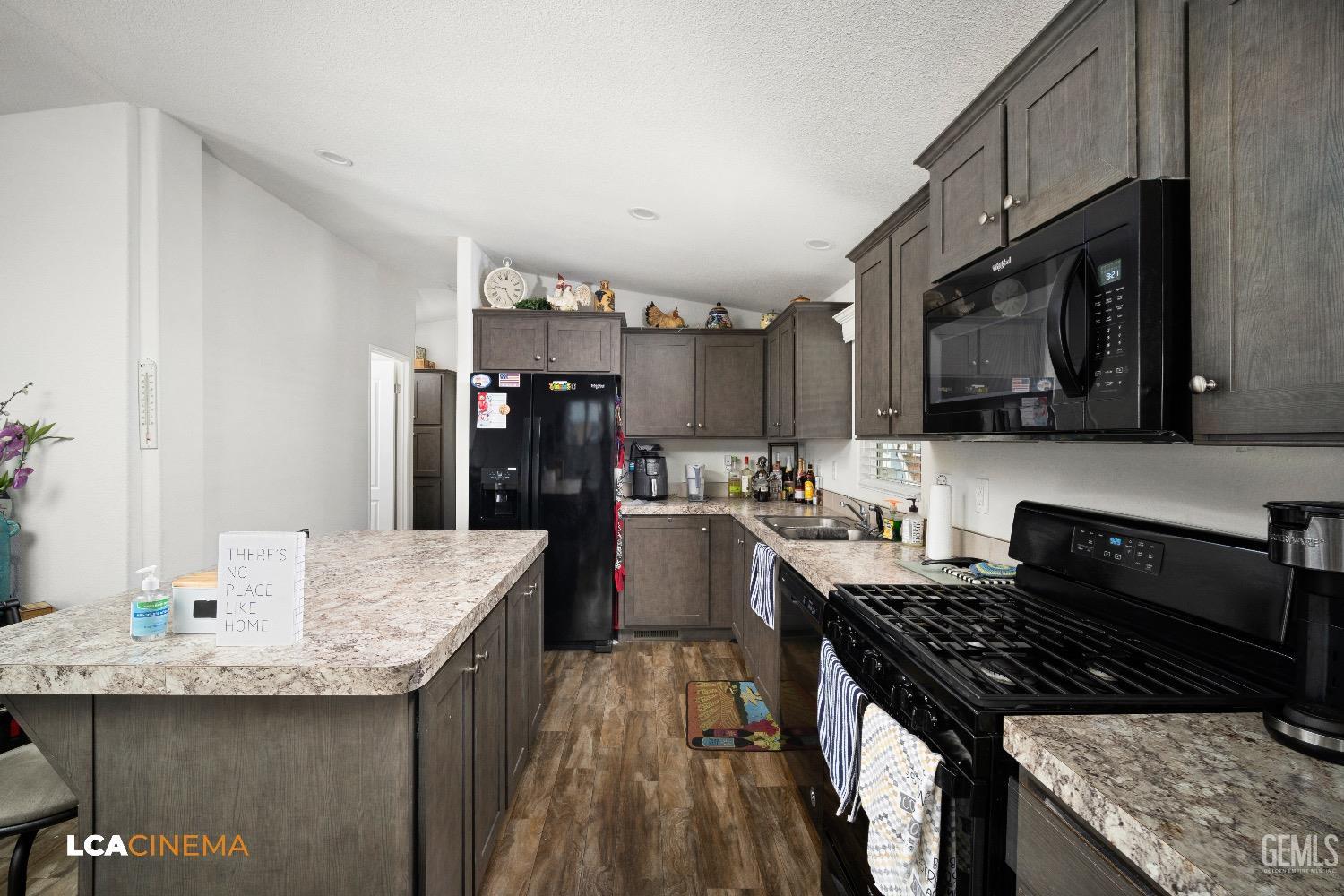 Undisclosed Address Bakersfield, CA 93304 - Photo 9 of 18 a kitchen with granite countertop lots of counter top space and stainless steel appliances