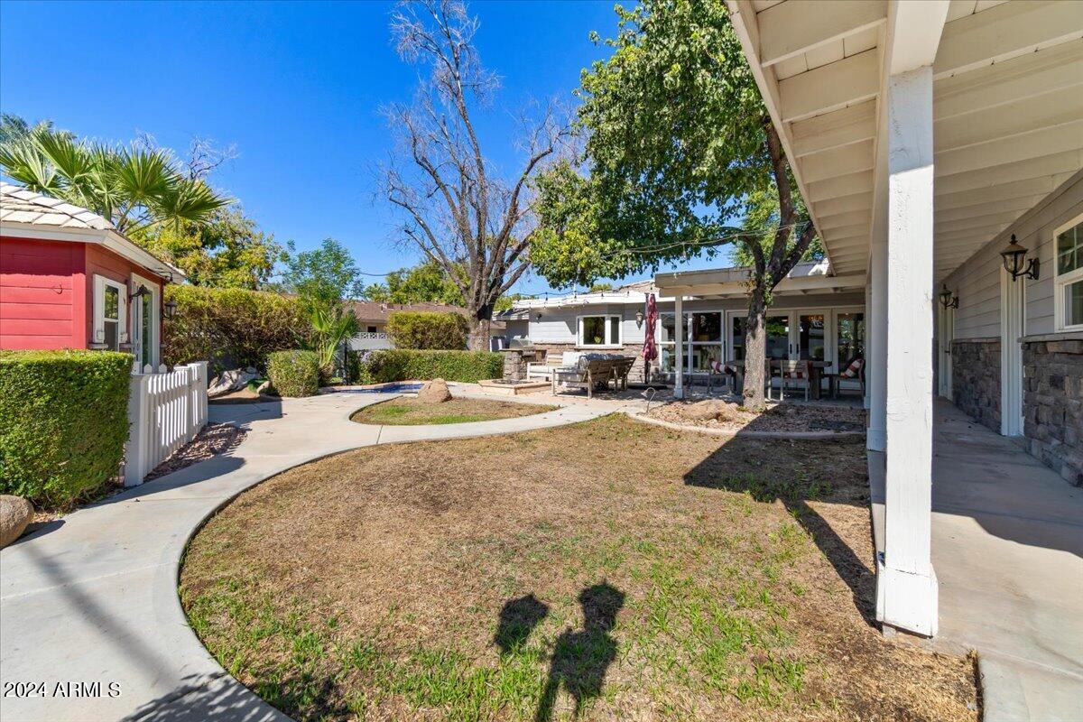 3841 East Elm Street Phoenix, AZ 85018 - Photo 50 of 72 a view of a swimming pool with a patio